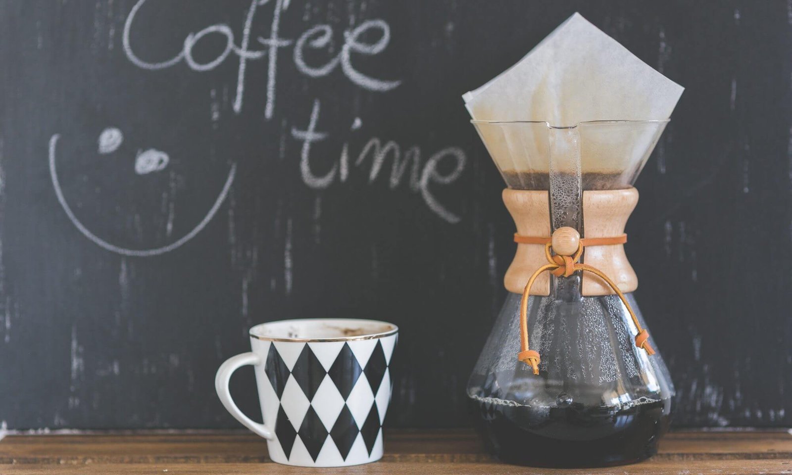 A cup of coffee on a wooden table